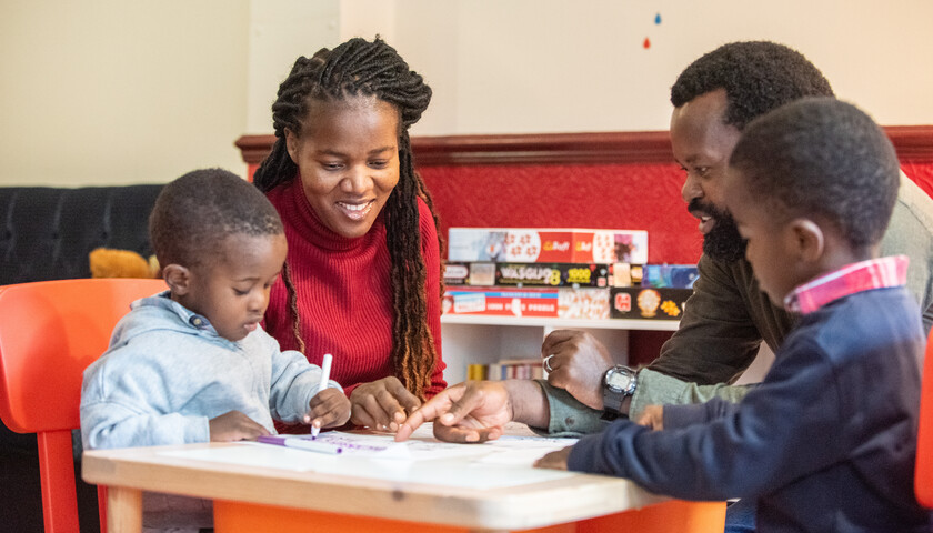 A family enjoying a meal in a campus restaurant