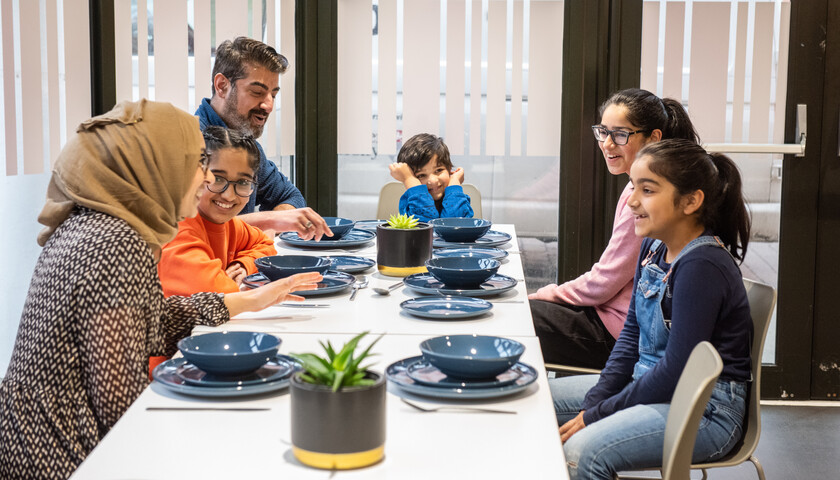 A family dining in a cafeteria