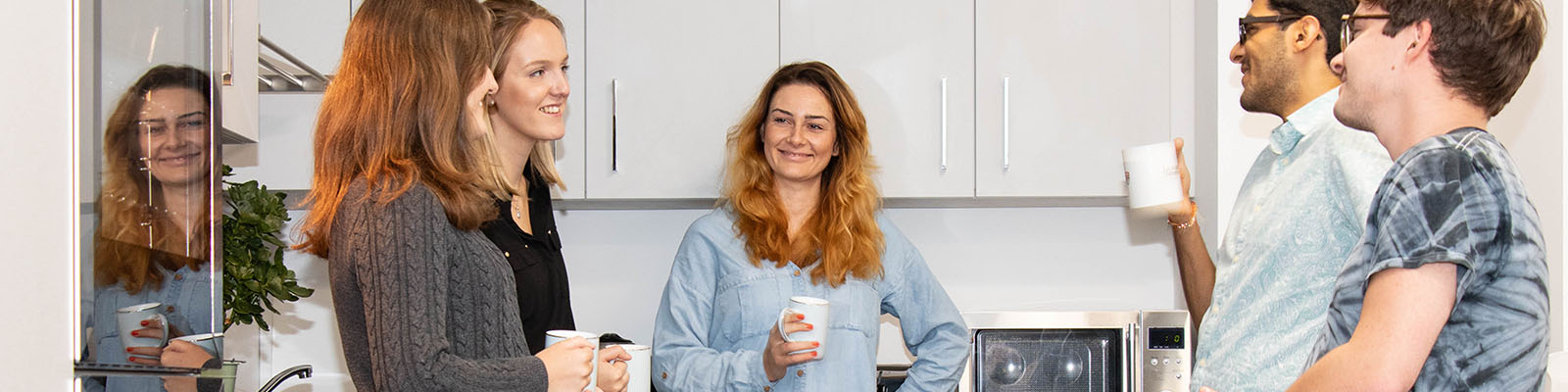 Students socialising in a kitchen