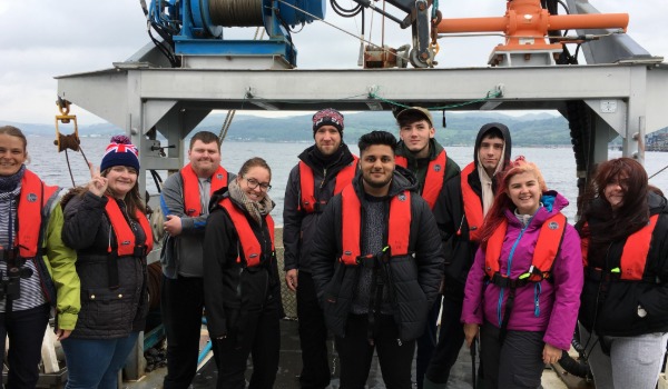 Students on top of a mountain