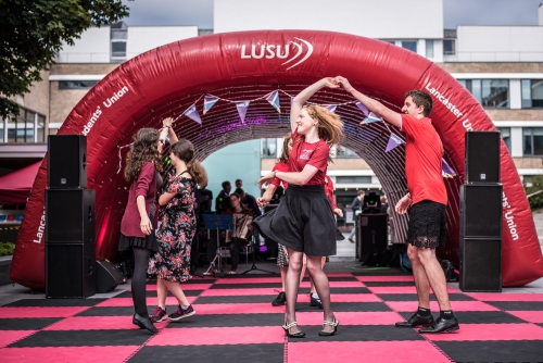 Three students performing at a Student Union event.