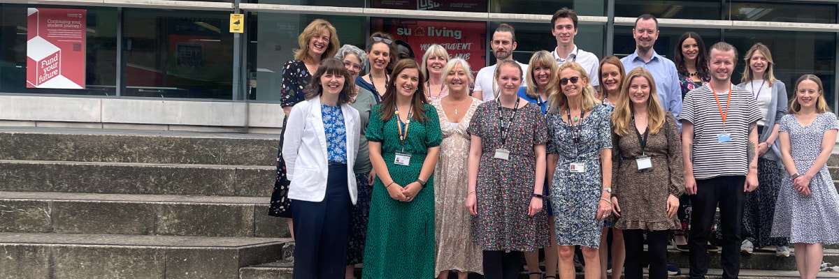 The Careers team standing together on the steps in Alexandra Square