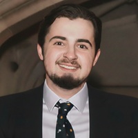 Close up of Christian wearing a suit