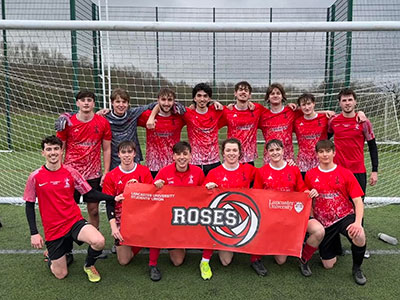 Bowland Football team in front of goal