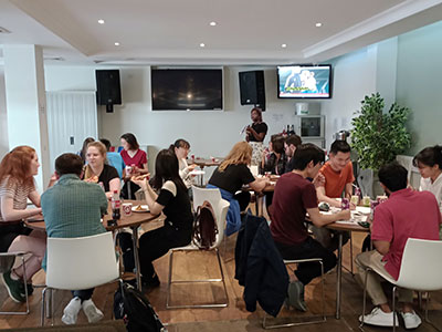 Picture of the inside of the Bowland common room, showing comfy sofas, study tables
