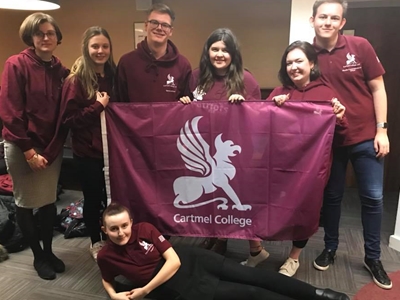 Cartmel Patriots team with flag