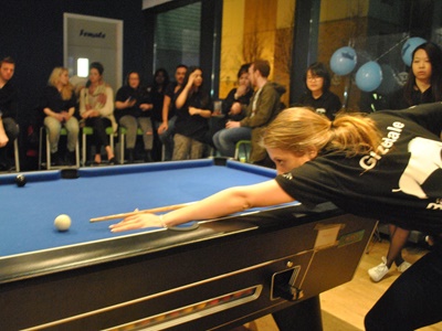 Someone playing pool