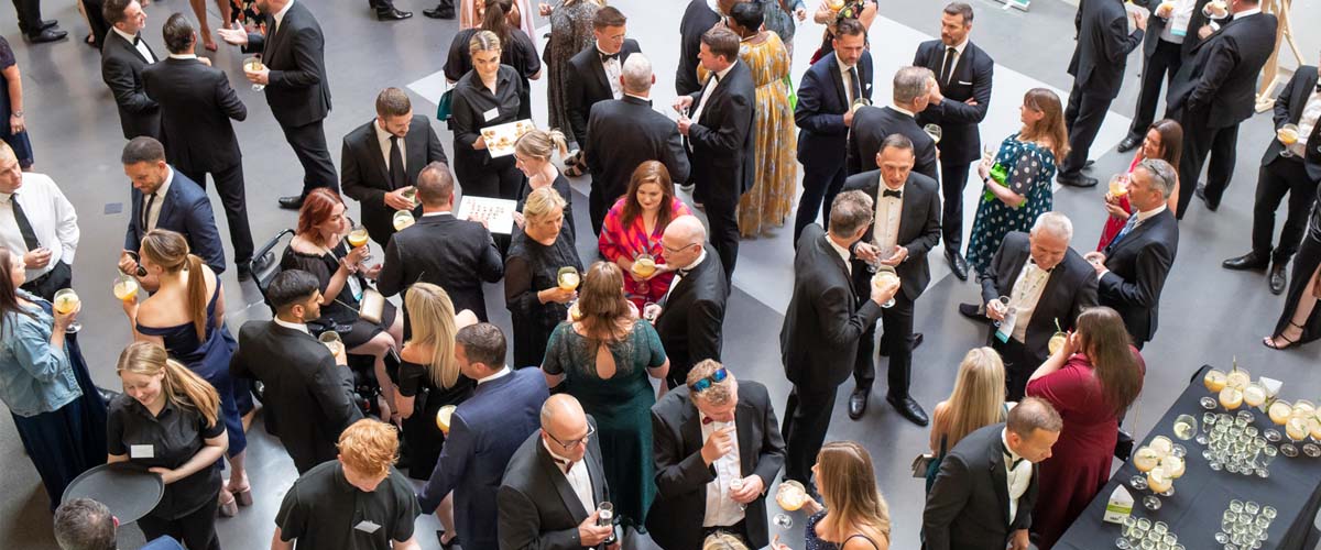 Birds eye shot of a black tie event during the CUBO Conference