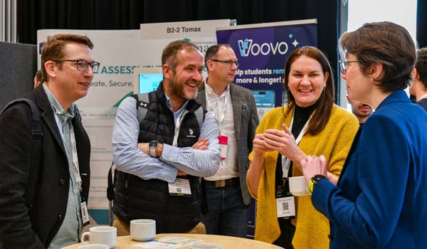 Group of people chatting at a conference