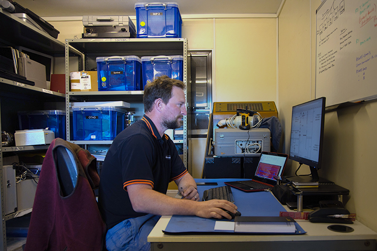 Business leader working on their data on a desktop computer.