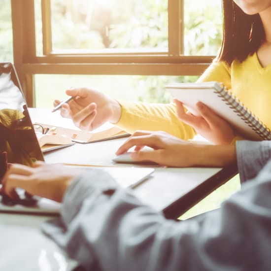 Two people working together and collaborating on a project.