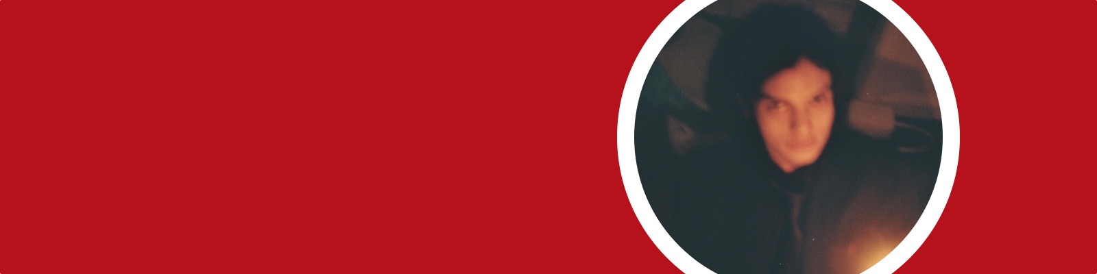 Fergal holds a flame in his hand in the dark