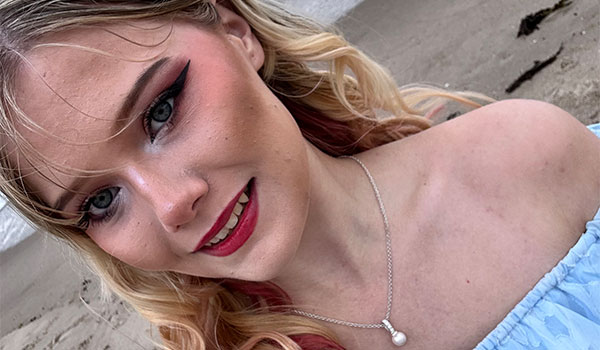 Student smiling at the camera