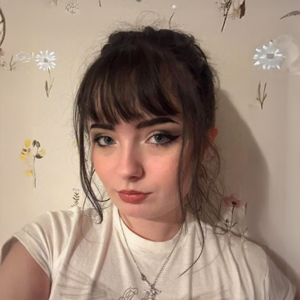 Student smiling at the camera