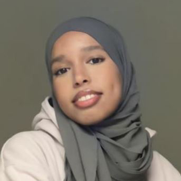 Student smiling at the camera