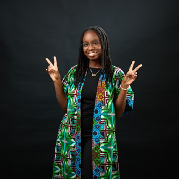 Image of student Naa smiling at the camera 