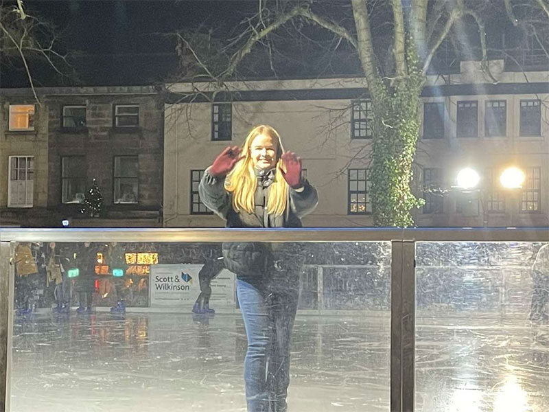 Ellie waving from the Ice Rink.