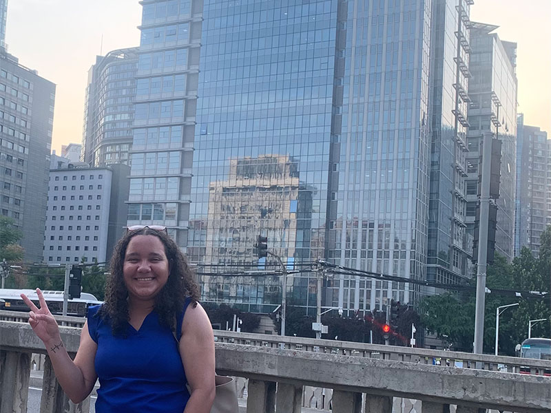 Lyea standing outside a building in Beijing.