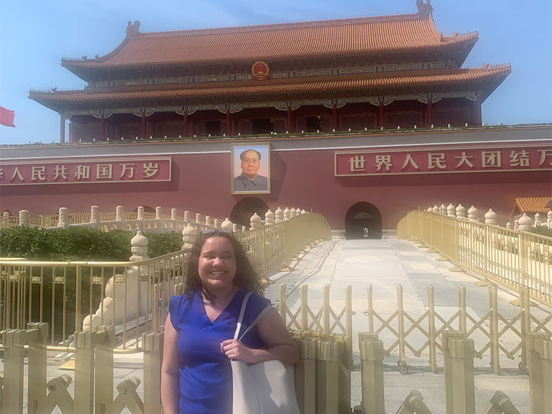 Lyea standing in front of the Tiananmen-square in Beijing.