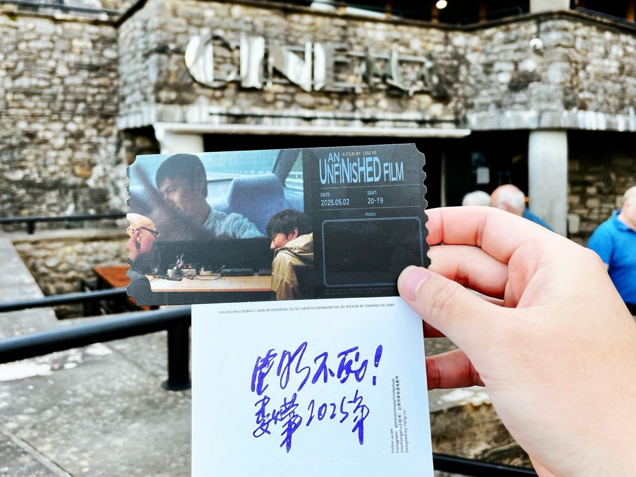 A person holding a film ticket outside the Brewery Arts Centre.