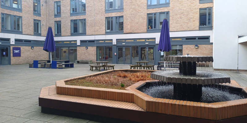 Image of the outside seating area of Trevor bar, an on-campus college bar and social area.