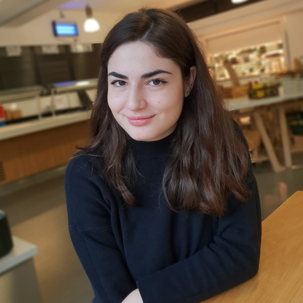 Head and shoulders picture of a female student looking up at the camera