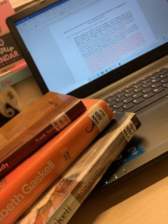 A laptop and some books