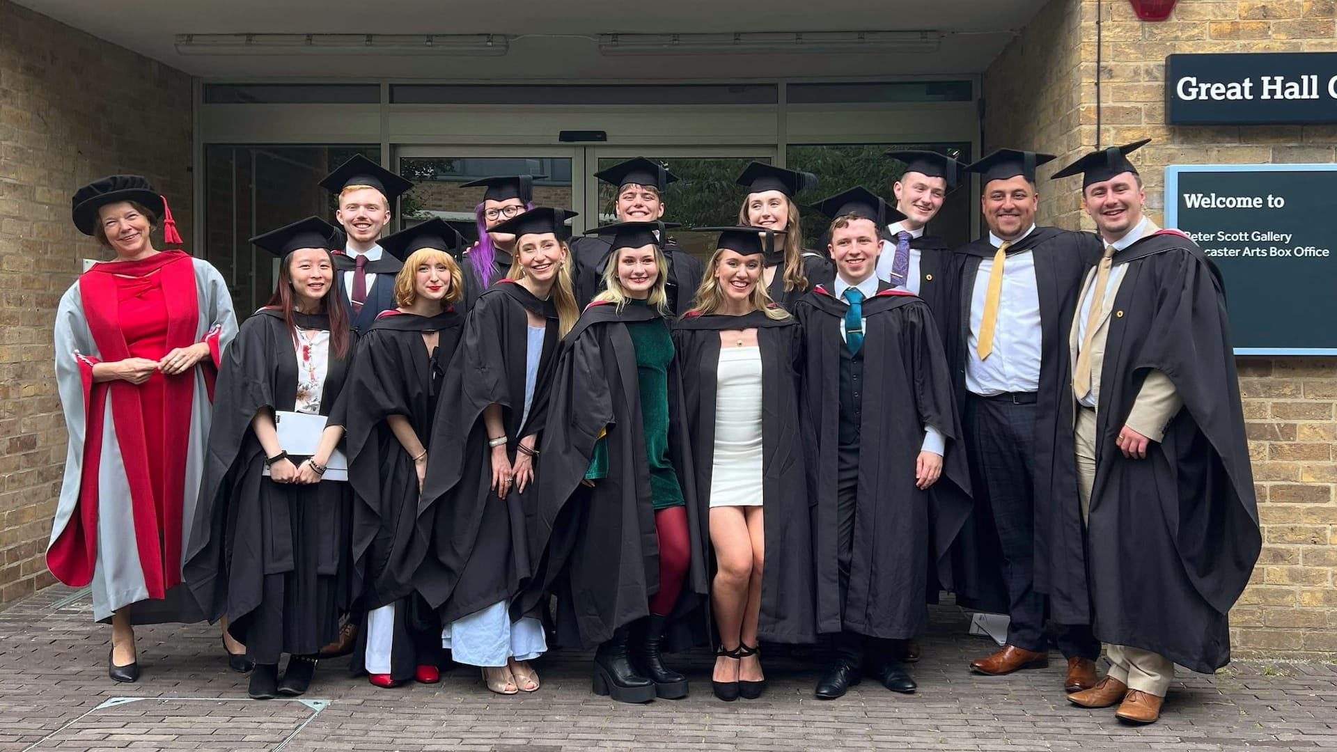 Catherine and her classmates pose for a photo by the Great Hall