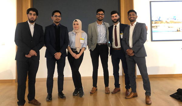 a group of students standing in a row