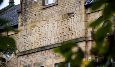 Historic building with engraving 'Lancaster & Skerton Equitable Industrial Co-operative society.