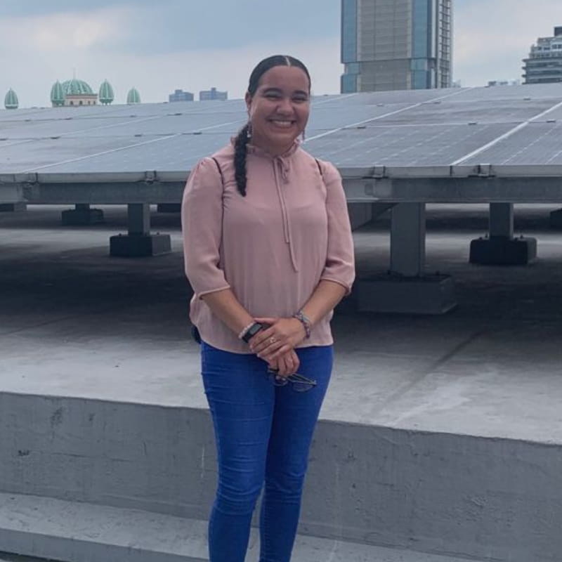 Adi and Rani presenting in front of screen