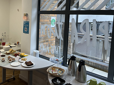 A table filled with cakes and drinks