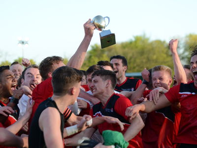 Footballers celebrating the win