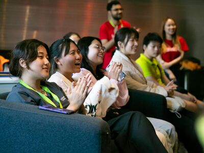 Students smiling and clapping