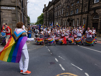 A person wearing a pride flag