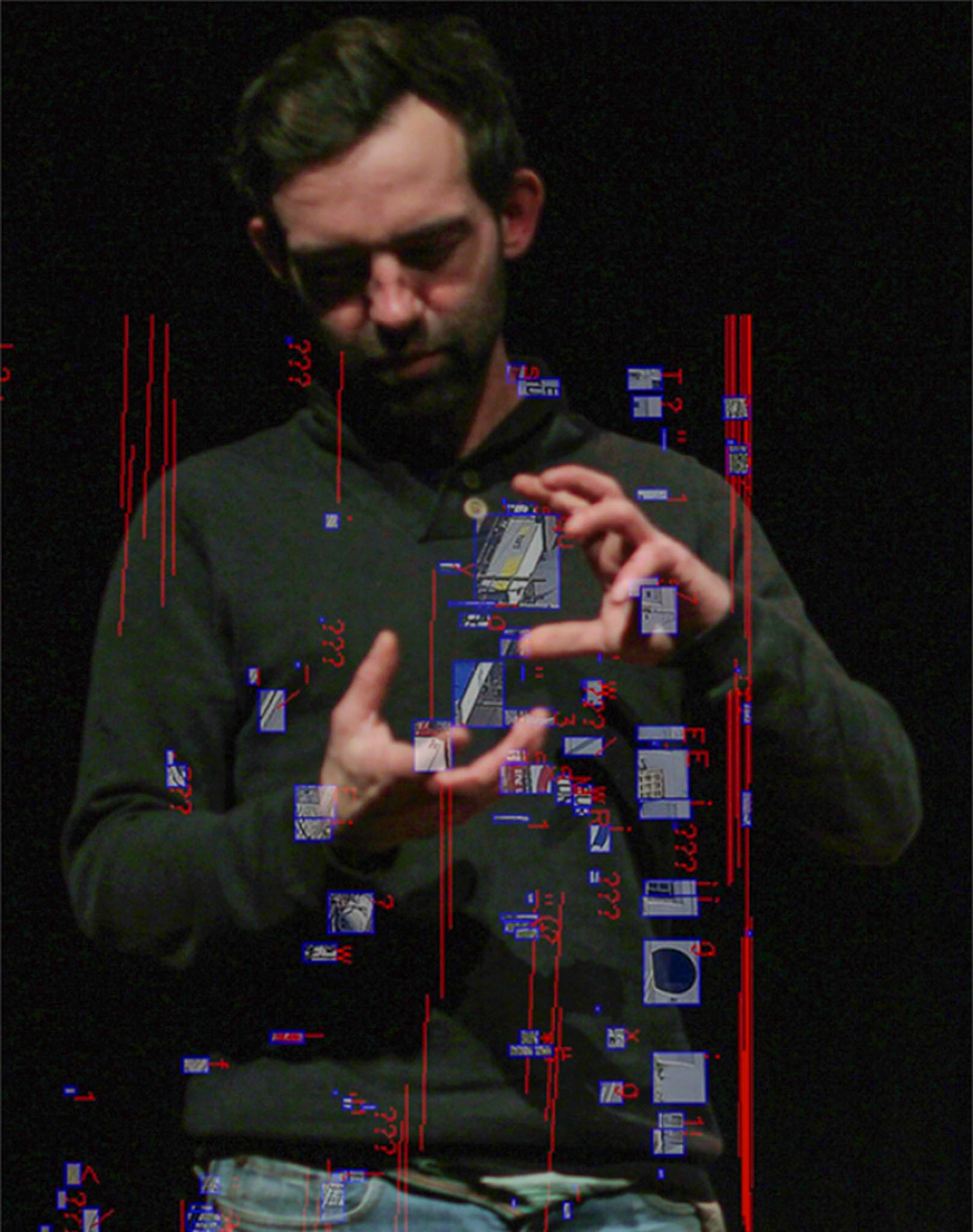 Portrait of Dr Nathan Jones with a dark bakcground.