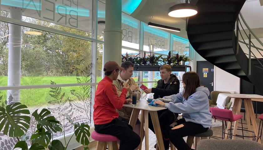 Students drinking coffee in a campus coffee bar