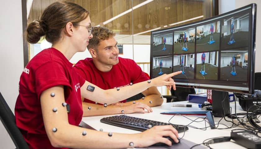 Two students working in the biomechanics lab.