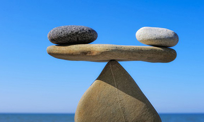 stones balanced above a stone fulcrum