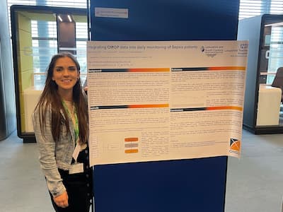 Quin Davies presenting a poster at an event