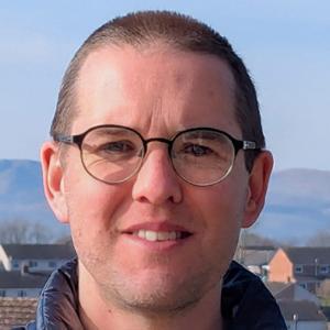 A head and shoulders photograph of Jamie Hodge