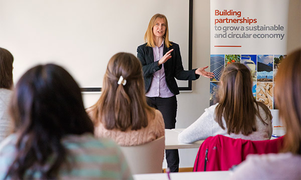 Presenter talking to a class