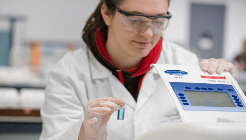 A student in an environmental chemistry lab
