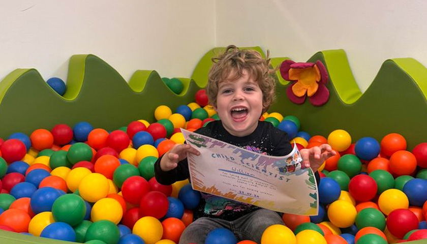 A child in a ballpit