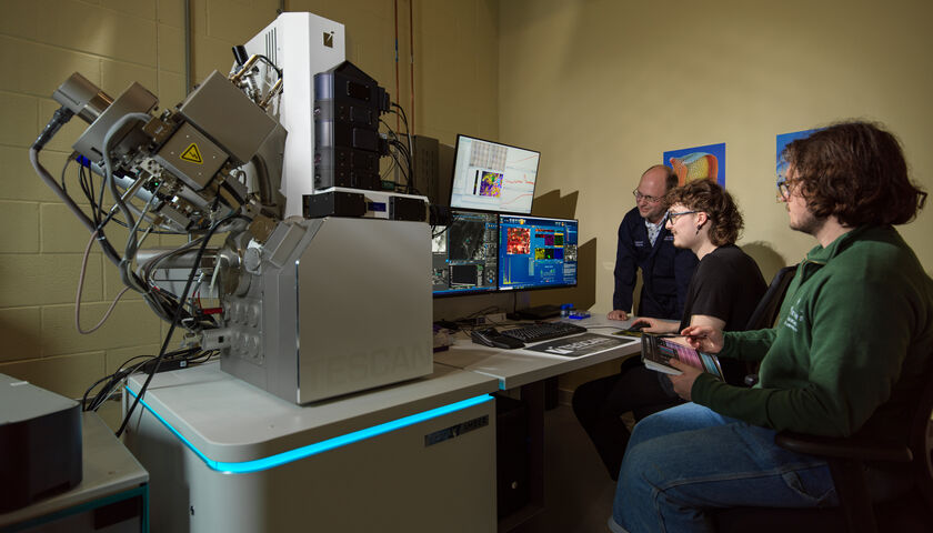 Students and an academic working on the SAFER machine