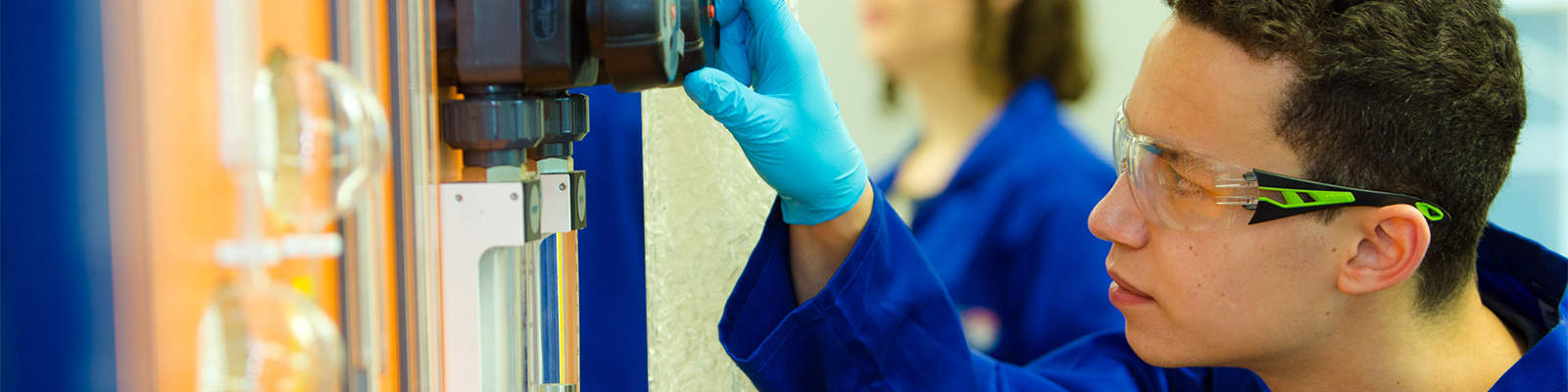 A student working on an electronics board