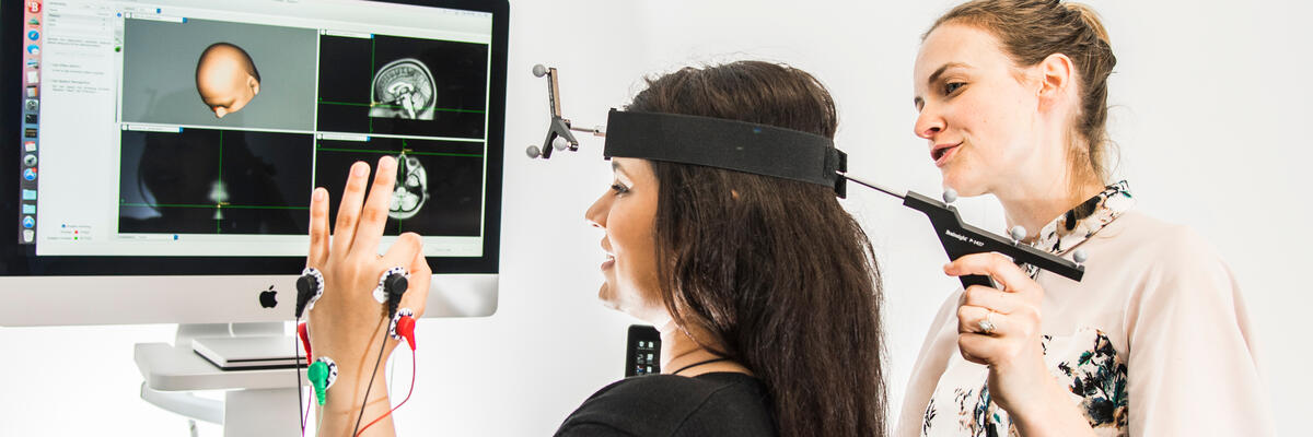 An academic carrying out a TMS experiment
