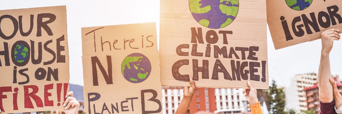People holding banners up at a climate protest