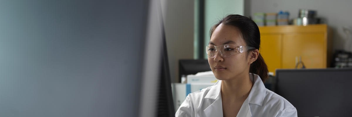 A student working on a computer in the chemical engineering labs