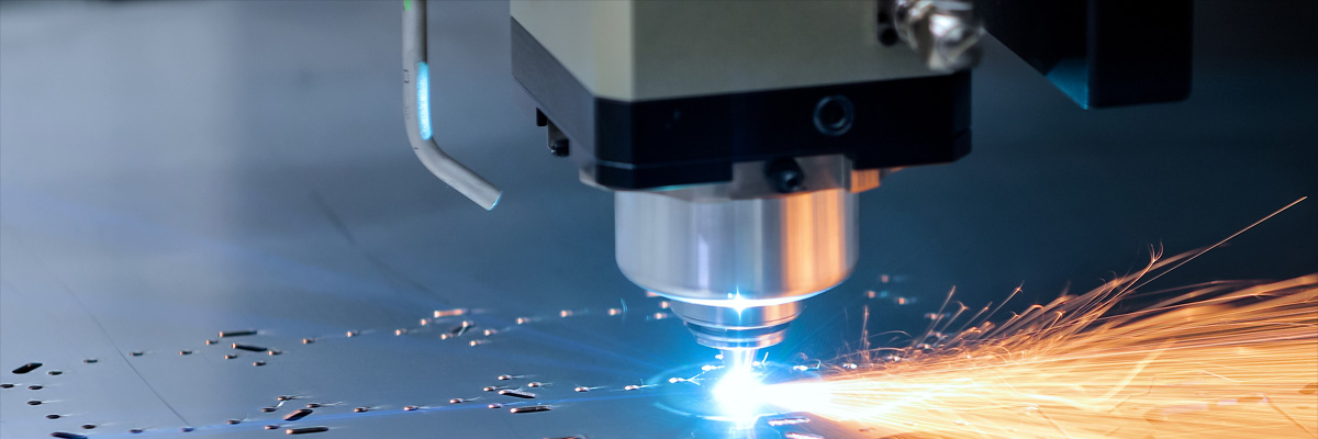 A laser cutter cutting out elements from a sheet of metal